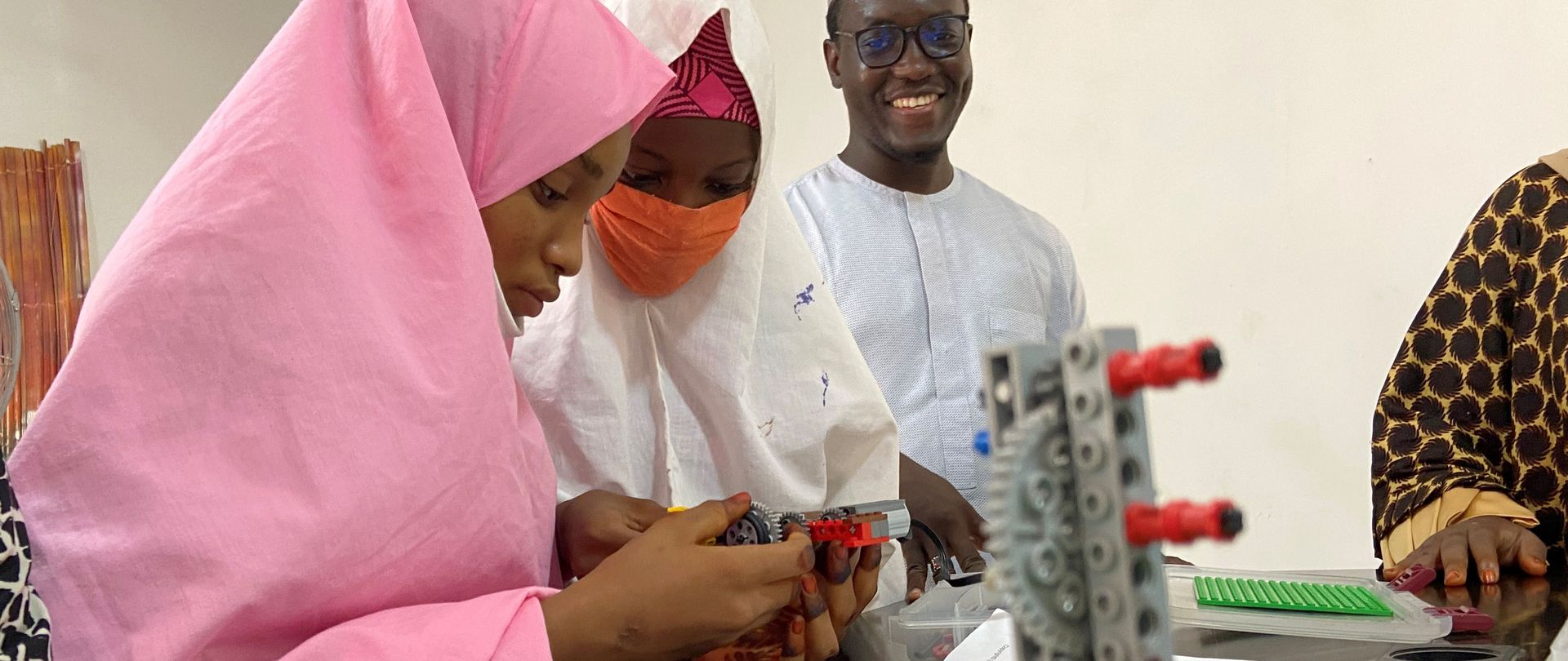 Teenage girls in northern Nigeria assemble Legos during a STEM class. 