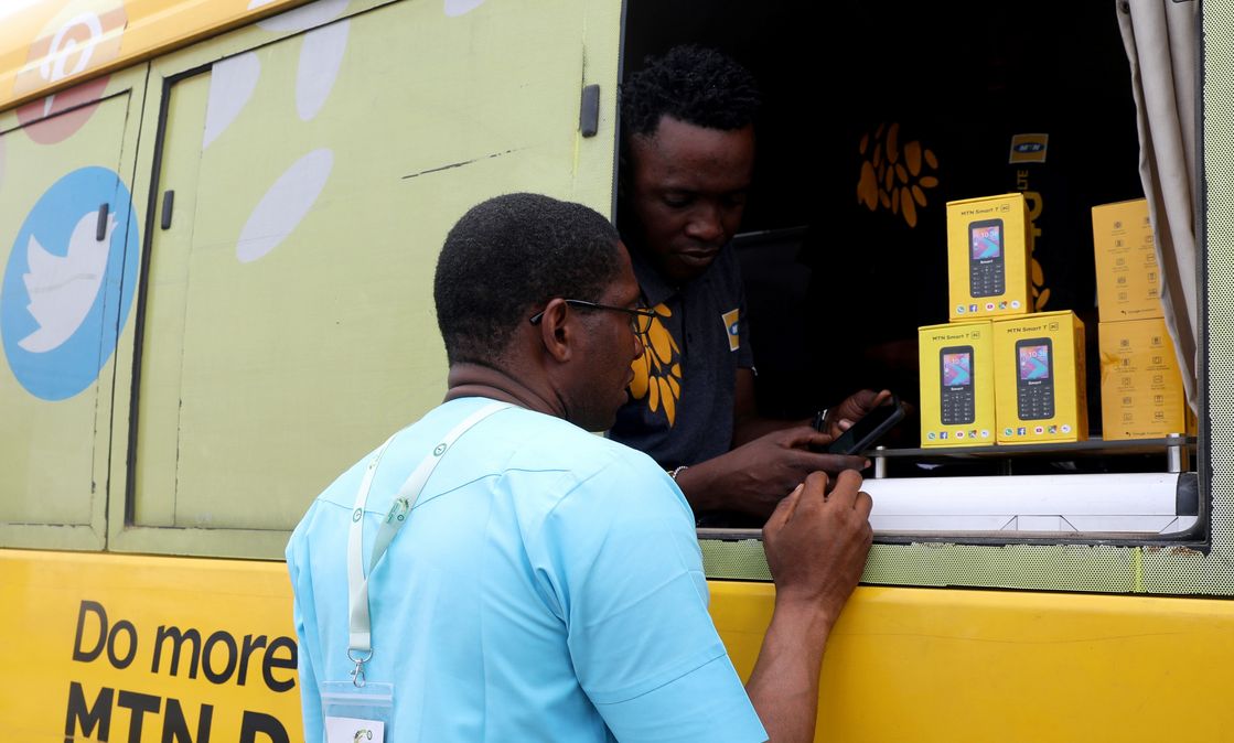 An MTN customer care staff attends to a client in an MTN service bus in Lagos, Nigeria August 28, 2019. 