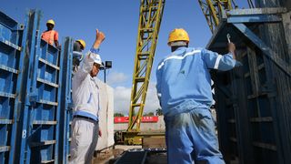 Chinese and Kenyan workers at Lamu Port Project construction site in 2017.