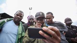 August 15, 2022, Nairobi: Kenyans follow proceeding as election results are announced. 