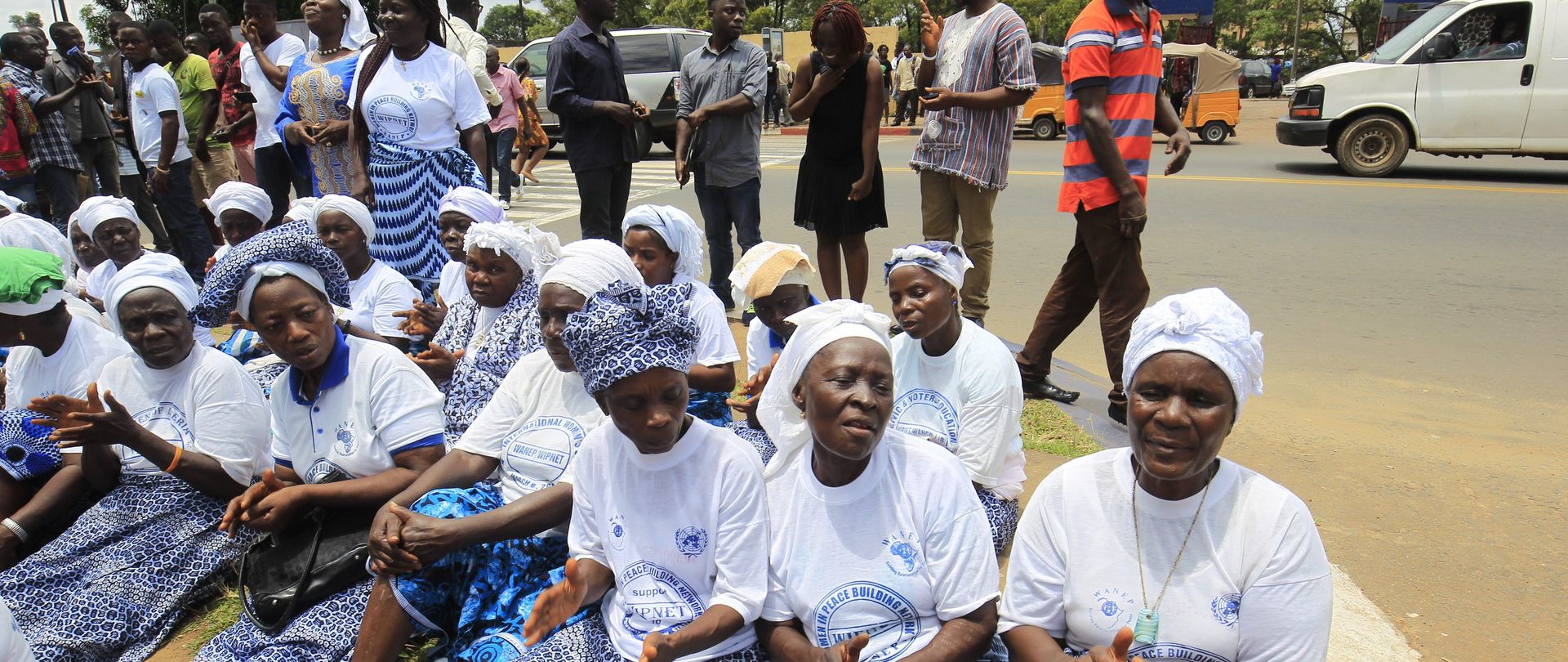 Liberia Women in Peace Building Network (WIPNET) pray for Peace on a roadside outside Parliament at the Capitol Building offices in Monrovia, Liberia, 11 August 2016. 