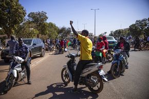 People cheering of putchist soldiers on the streets of Ouagadougou, Burkina Faso.