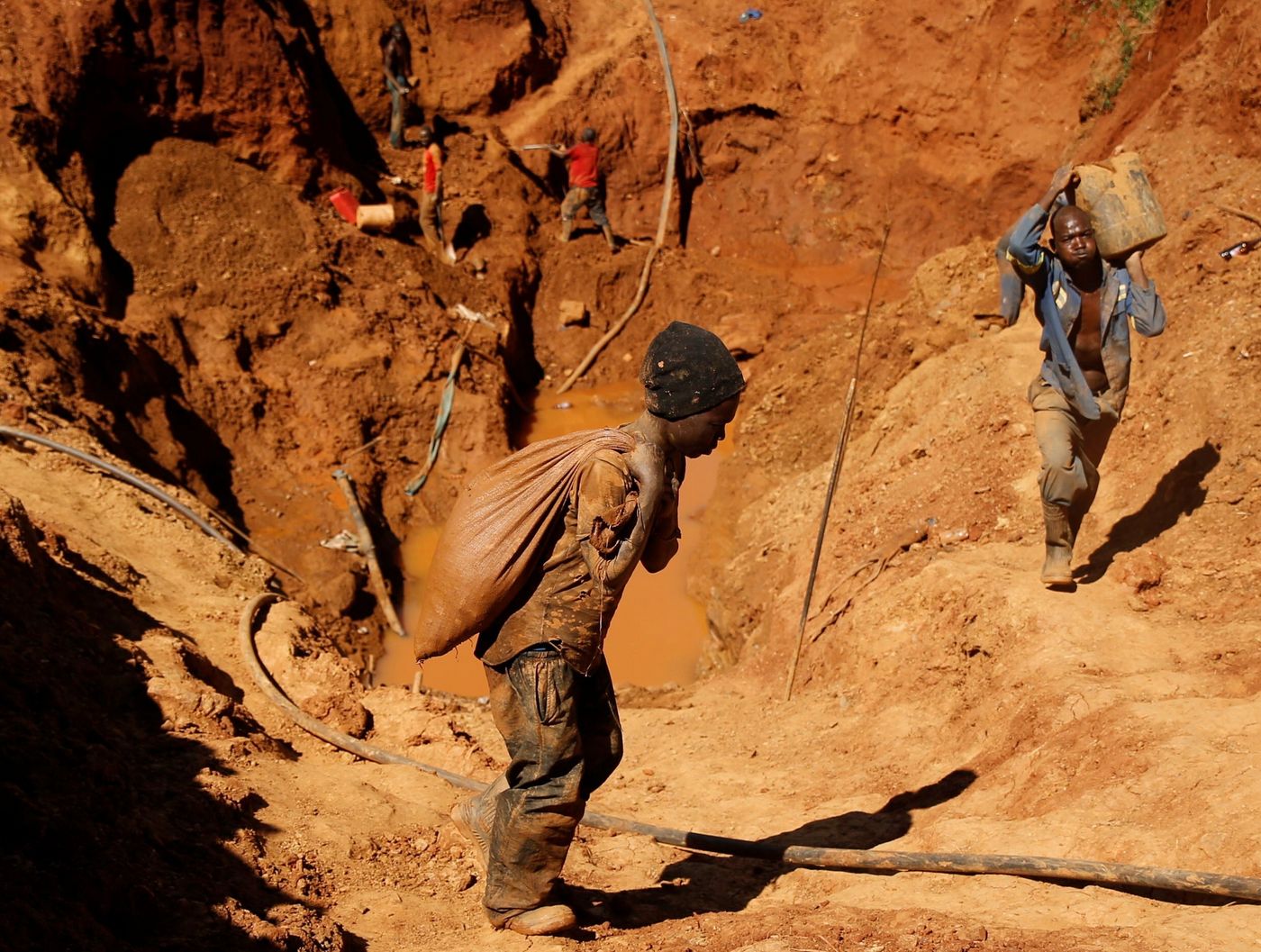 2018: Illegal artisanal gold miners work at an open mine in Mazowe, Zimbabwe.