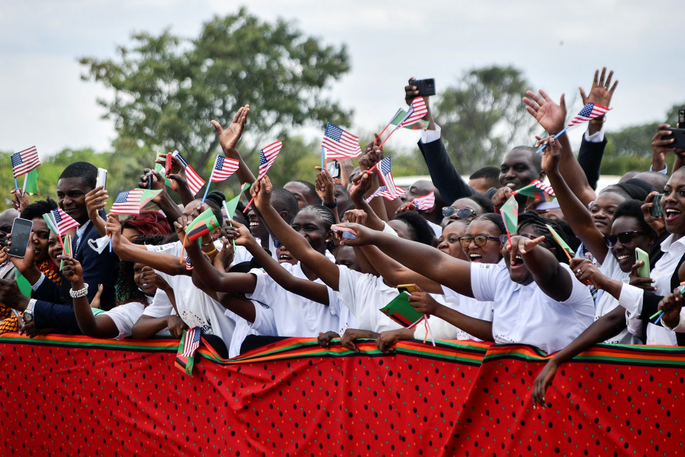 Zambia, 2023: People cheer and wave American flags during the visit of U.S. Vice President Kamala Harris in Lusaka.
